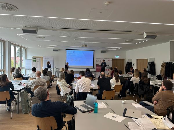 Vortragende und Publikum