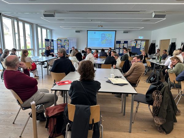 Vortragende und Publikum